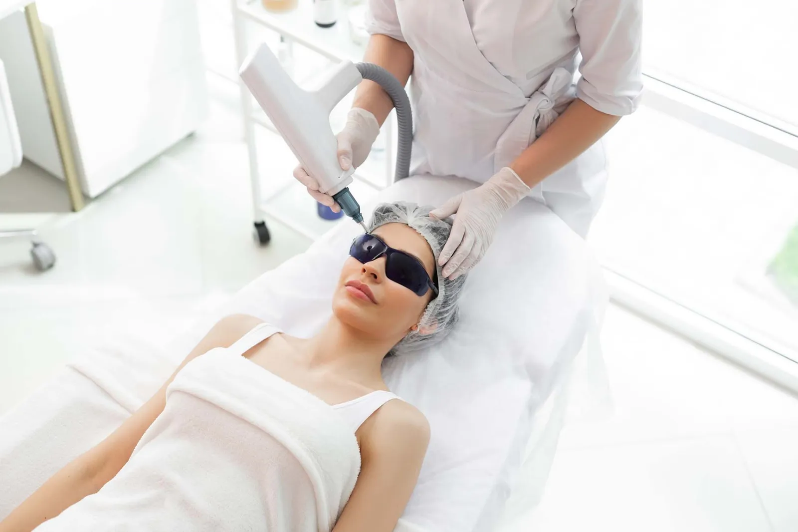 Nice positive woman receiving professional beauty treatment